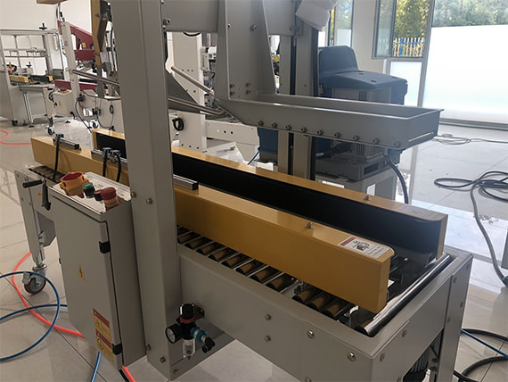 Máy dán thùng carton bằng keo nóng