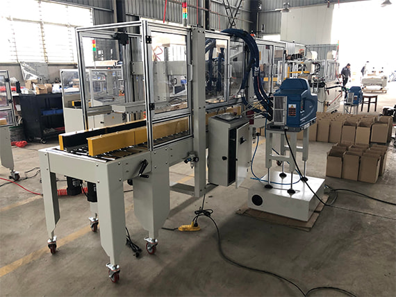 Máy dán thùng carton bằng keo nóng